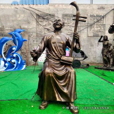 铜雕唱戏人物