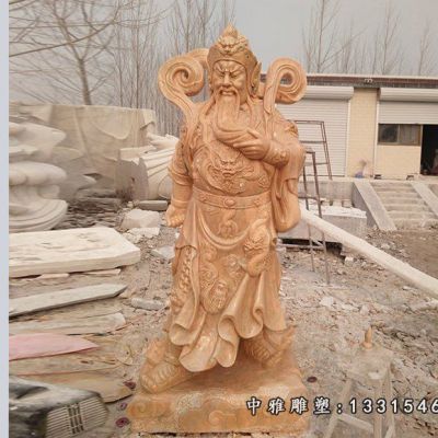 晚霞红石雕关公