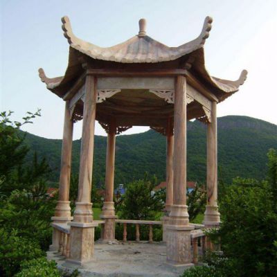 户外晚霞红石雕凉亭